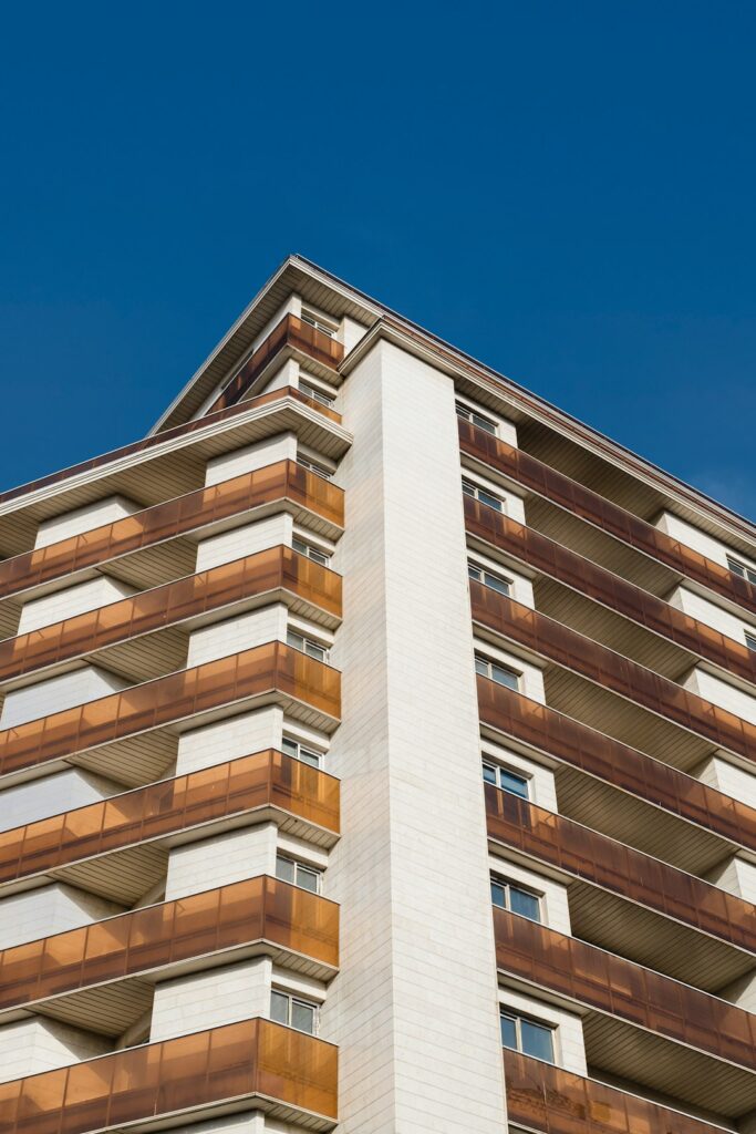 a tall building with balconies on top of it