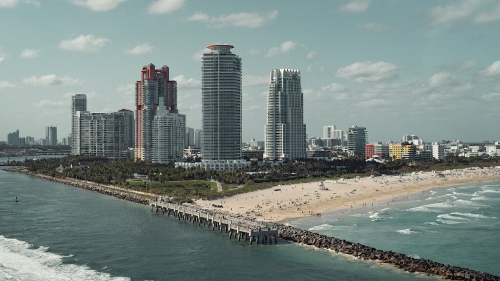 a view of a beach and a city in the background