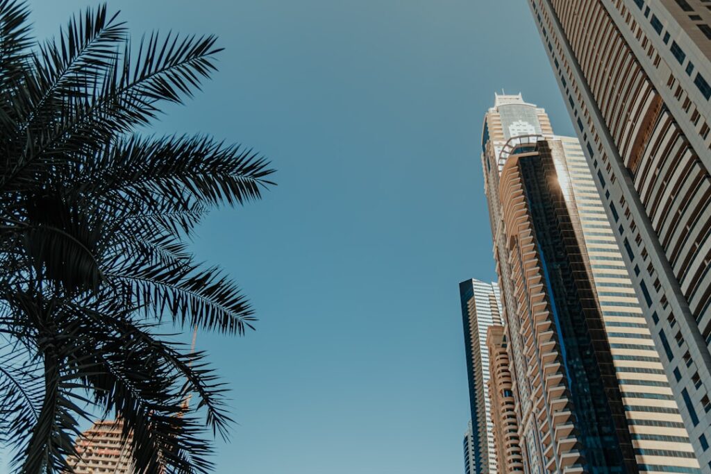 A tall building with a palm tree in front of it