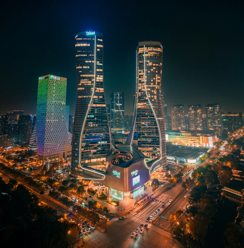 Illuminated skyscrapers light up the city at night.