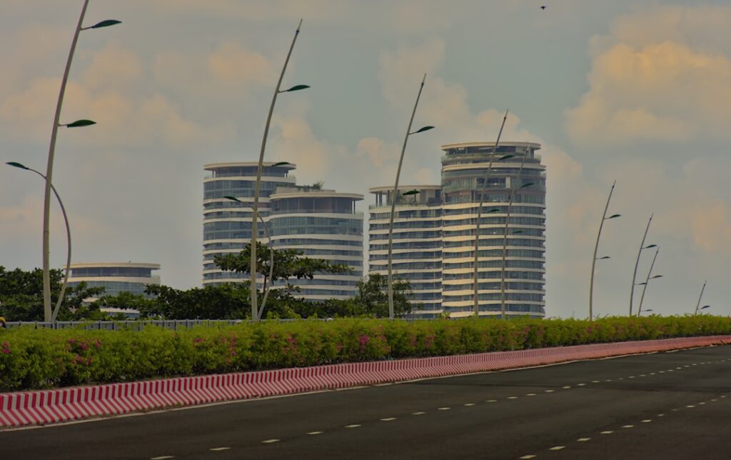 A highway with a bunch of tall buildings in the background