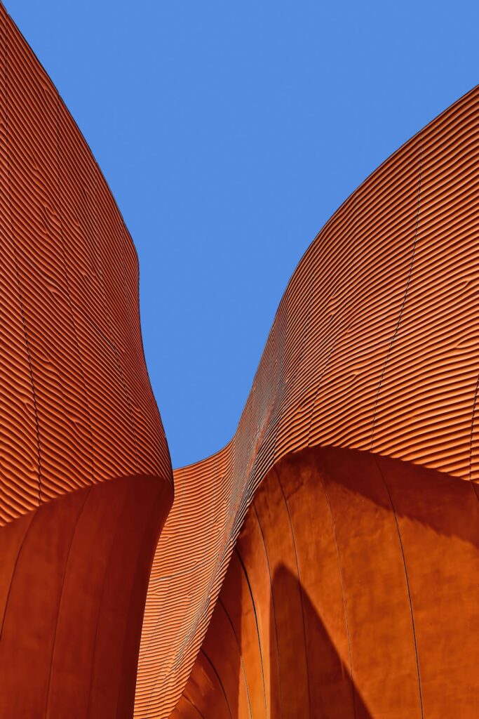 minimalist photography of brown wavy structure