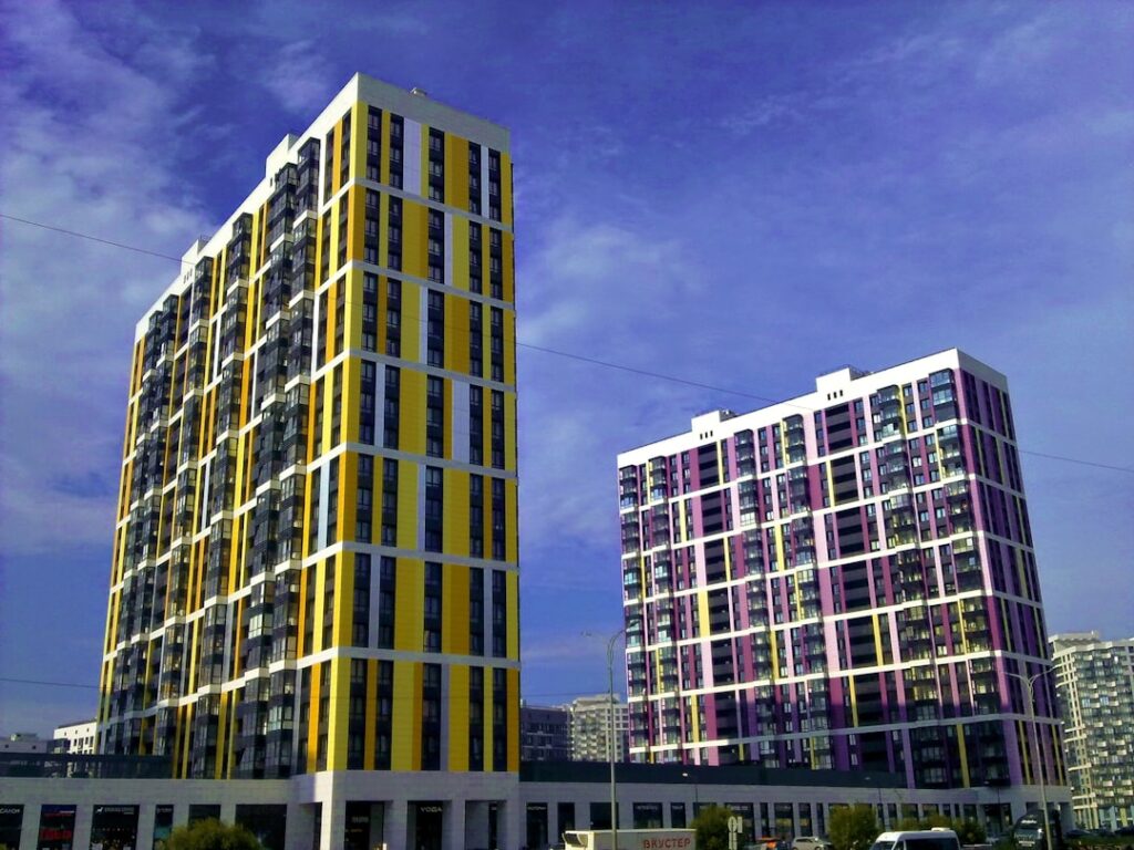 Modern apartment buildings against a blue sky